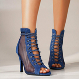 Fishnet high-heel boots.