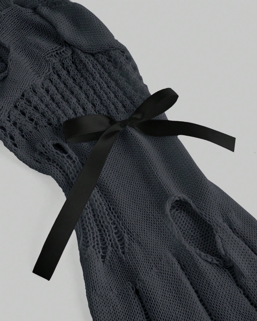 Hollow-shoulder knitted sweater